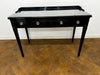 A 3 Drawer Dressing Table with Glass Top Finished in Black Lacquer.