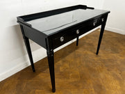 A 3 Drawer Dressing Table with Glass Top Finished in Black Lacquer.