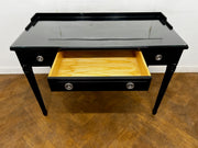 A 3 Drawer Dressing Table with Glass Top Finished in Black Lacquer.