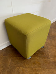 Used Task Padded Green Fabric Cube Stool on Wheels.