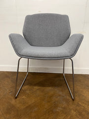 Used Boss Design Kruze Lounge Chair with Steel Sled Base Re-upholstered in Grey cloth.