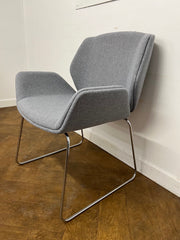 Used Boss Design Kruze Lounge Chair with Steel Sled Base Re-upholstered in Grey cloth.